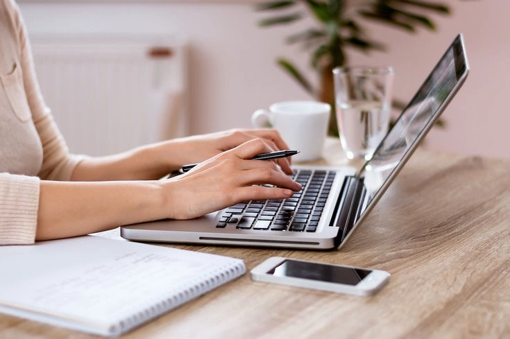Freelance Digital Marketer in Kochi working in Laptop